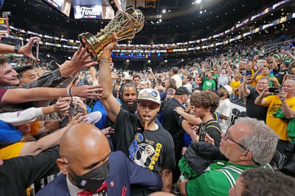 PHOTO: FILE - Stephen Curry #30 of the Golden State Warriors celebrates with the Bill Russell Finals MVP Trophy after winning during Game Six of the 2022 NBA Finals, June 16, 2022 at TD Garden in Boston. (Jesse D. Garrabrant/NBAE via Getty Images, FILE)