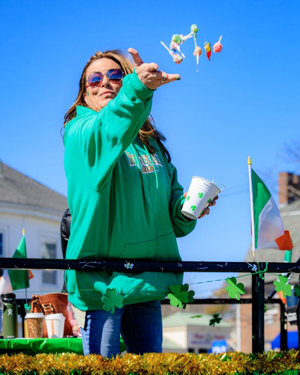 Megan Gajewski throws candy into the crowd.