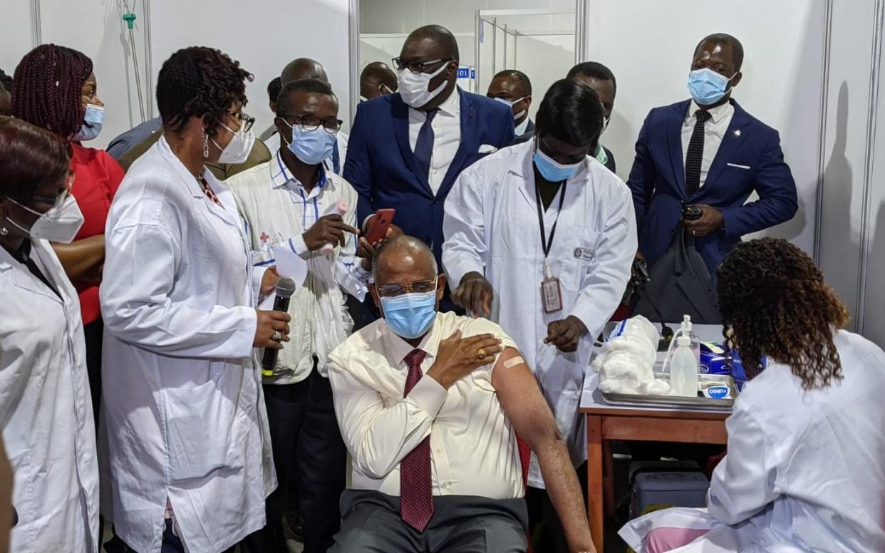 Secrétaire général de la présidence, Patrick Achi, receives the first Covax jab at the Parc des Sports in Abidjan, Côte d'Ivoire - Paul Nuki