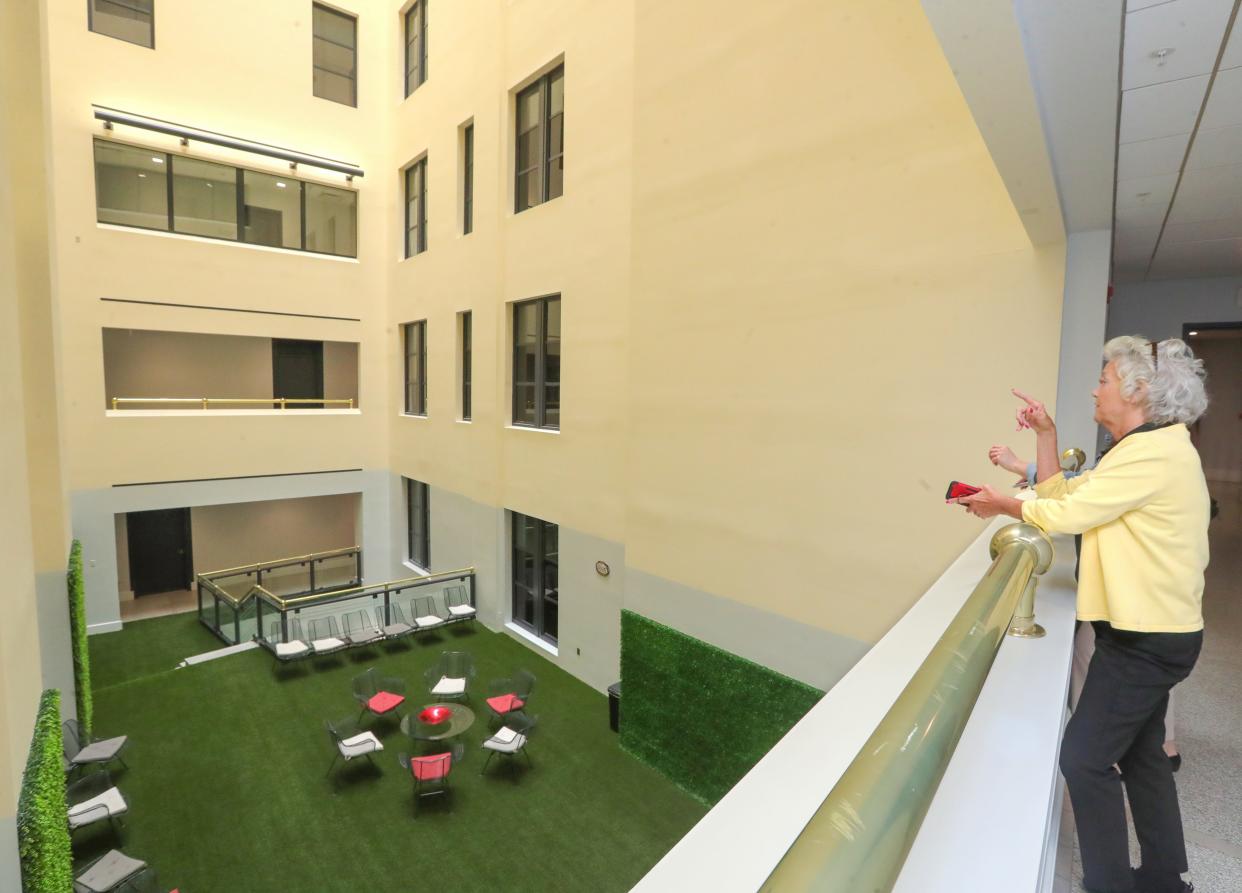 Commercial Property Partners Property Manager Lori Sumner shows off the atrium space at 159 S. Main Street.