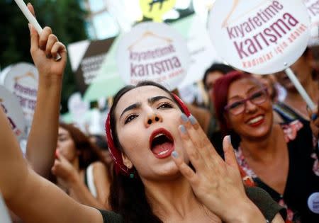 Women rights activists shout slogans during a protest against what they say are violence and animosity they face from men demanding they dress more conservatively, in Istanbul, Turkey, July 29, 2017. REUTERS/Murad Sezer