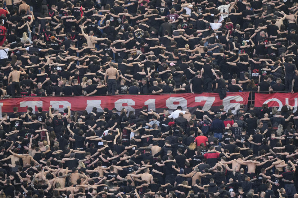 AC Milan's supporters cheer during the Serie A soccer match between AC Milan and Lecce at the San Siro stadium, in Milan, Italy, Saturday, April 6, 2024. (AP Photo/Antonio Calanni)