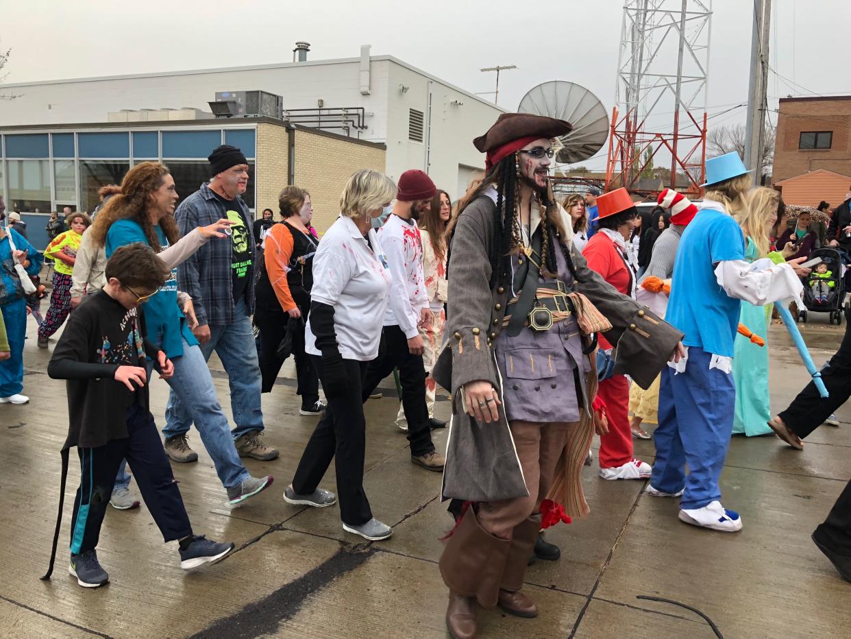 Zombie Captain Jack Sparrow makes his way along 13th Street in downtown Sioux Falls as part of the 2018 Sioux Falls Zombie Walk on Oct. 27, 2018.