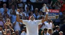 Tennis - Wimbledon - All England Lawn Tennis and Croquet Club, London, Britain - July 15, 2018 Serbia's Novak Djokovic celebrates winning the men's singles final against South Africa's Kevin Anderson REUTERS/Tony O'Brien