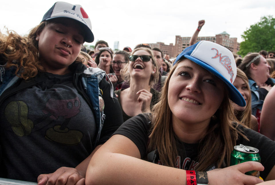 Shannon Petree, right, of Huntington West Virginia, watches the band Delta Spirit perform during the inaugural Shaky Knees Music Festival on Sunday, May 5, 2013, in Atlanta. (AP Photo/Ron Harris)