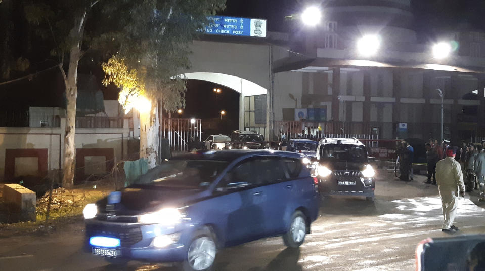 The convoy carrying Indian air force Wing Commander Abhinandan Varthaman drives out from the Integrated Check Post on the Indian side of the border in Attari, India, Friday, March 1, 2019. Pakistani officials handed over the captured Indian pilot to a border crossing with India on Friday in a "gesture of peace" promised by Pakistani Prime Minister Imran Khan amid a dramatic escalation with the country's archrival over the disputed region of Kashmir. (AP Photo/Prabhjot Gill)