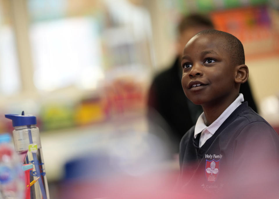 Noah Popula listens to his teacher during a year 2 lesson at the Holy Family Catholic Primary School in Greenwich, London, Thursday, May 20, 2021. (AP Photo/Alastair Grant)