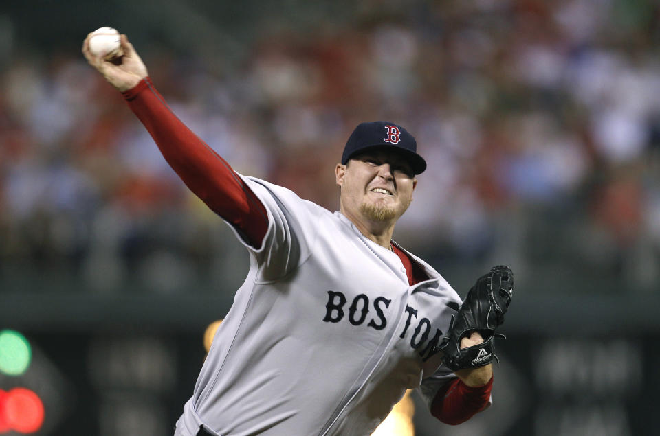 FILE - In this June 28, 2011 file photo, Boston Red Sox pitcher Bobby Jenks delivers during a baseball game against the Philadelphia Phillies in Philadelphia. Jenks reached an out-of-court settlement with Massachusetts General Hospital and the attending surgeon on Wednesday, May 8, 2019, over a December 2011 surgery he said caused his career-ending spine injury. (AP Photo/Matt Slocum, File)