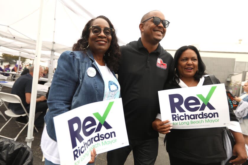 LOS ANGELES, CA - SEPTEMBER 17, 2022 - - Long Beach Vice Mayor Rex Richardson, who is running for mayor of Long Beach, spends time with Yvonne Wheeler, left, and Los Angeles City Council Member Heather Hutt at a rally and BBQ at the headquarters for The Los Angeles County Federation of Labor, AFL-CIO to help mobilize for this election season in Los Angeles on September 17, 2022. (Genaro Molina / Los Angeles Times)