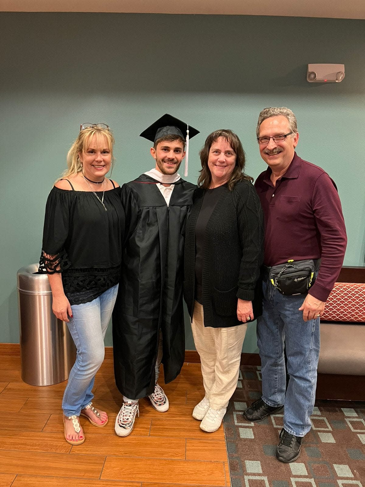 (From left) Kirsten Venditti, her son Alessandro Venditti, Gayle and Dave Boggess stand together after Alessandro's graduation from Grand View University.