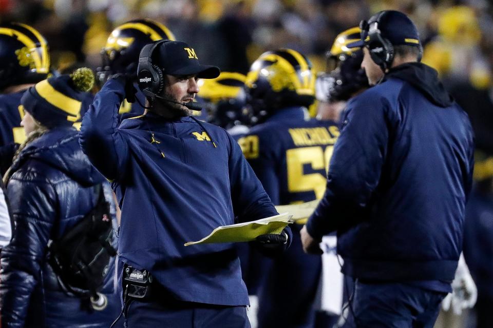 Michigan defensive coordinator Jesse Minter is the son of former Cincinnati head coach Rick Minter and could be a candidate to replace Luke Fickell at the helm of the Bearcats program.