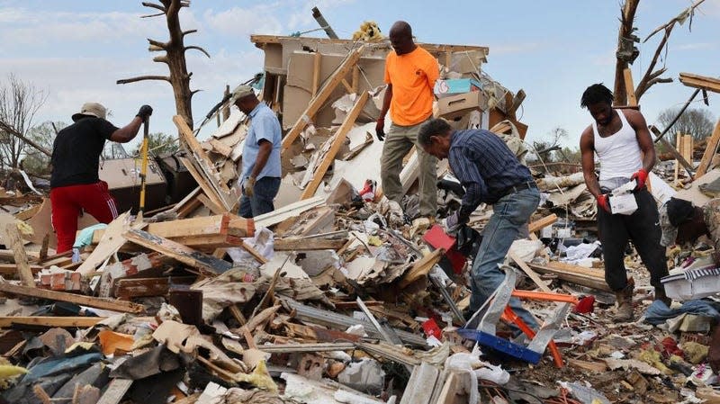 Residents recover possessions from homes that were destroyed by Friday’s tornado on March 26, 2023 in Rolling Fork, Mississippi.