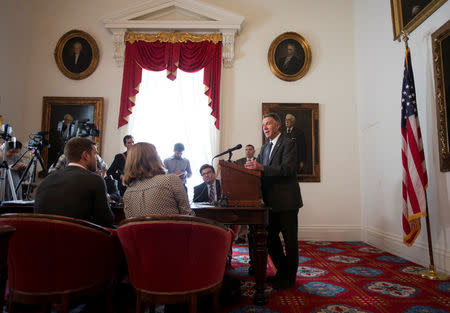 FILE PHOTO: Vermont governor Phil Scott speaks to the press in his offices at the State Legislature in Montpelier, Vermont, U.S., March 13, 2018. REUTERS/Christinne Muschi/File Photo