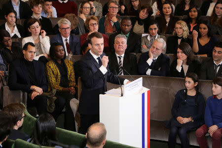 France's President Emmanuel Macron gives a speech to unveil his strategy to promote French language as part of the International Francophonie Day, before members of the French Academy and other guests, at the French Institute in Paris, France, March 20, 2018. Ludovic Marin/Pool via REUTERS