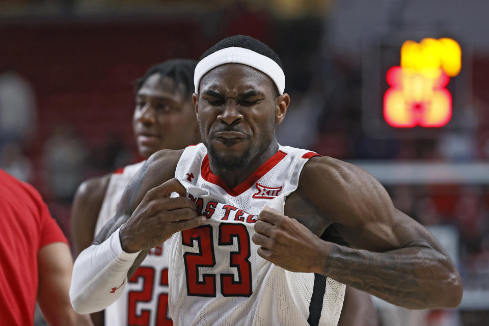 Texas Tech's De'Vion Harmon (23) pulls at his jersey during overtime of an NCAA college basketball game against Iowa State, Monday, Jan. 30, 2023, in Lubbock, Texas. (AP Photo/Brad Tollefson)