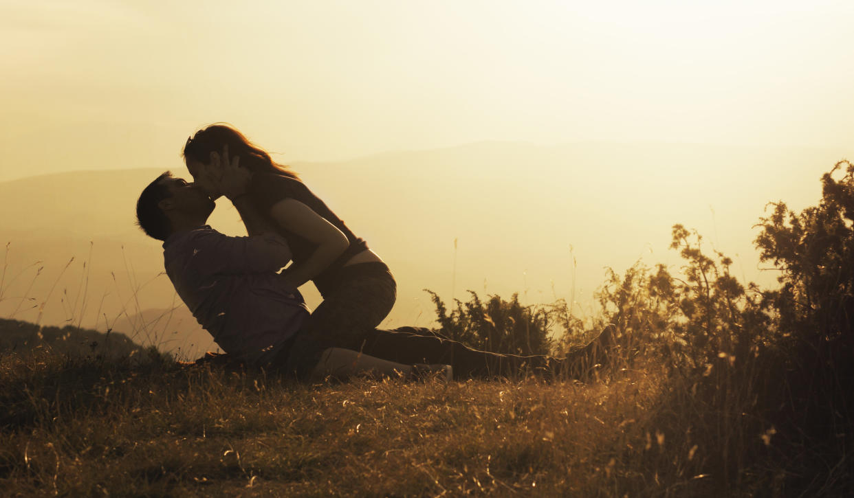 Young couple making love in nature