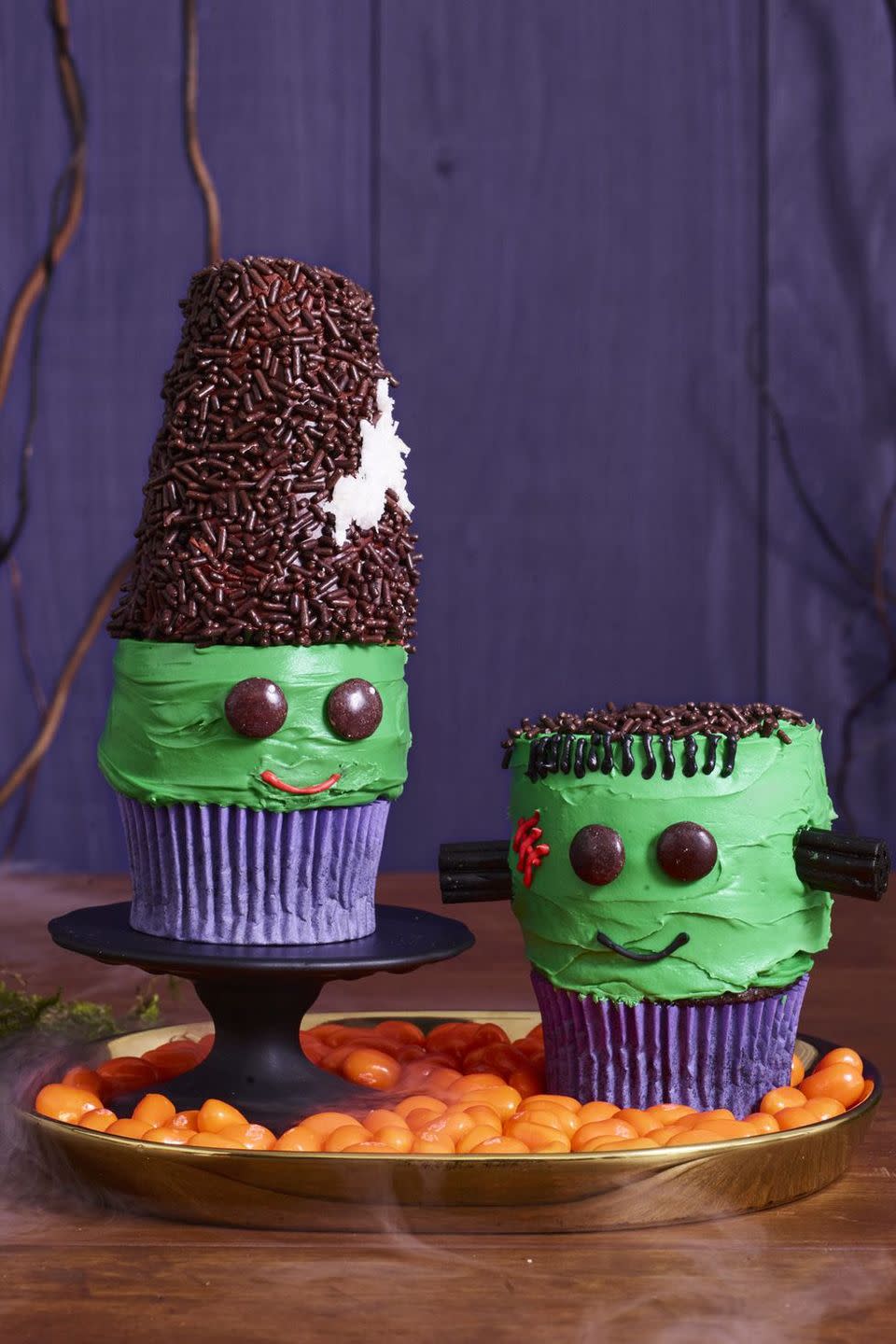 <p>Your kids will love adding the black licorice neck knobs and chocolate sprinkle hair to these treats.</p><p>Get the <strong><a href="https://www.womansday.com/food-recipes/food-drinks/a23570068/frankenstein-and-his-bride-cupcakes-recipe/" rel="nofollow noopener" target="_blank" data-ylk="slk:Frankenstein and His Bride Cupcakes recipe;elm:context_link;itc:0;sec:content-canvas" class="link ">Frankenstein and His Bride Cupcakes recipe</a></strong>.</p>