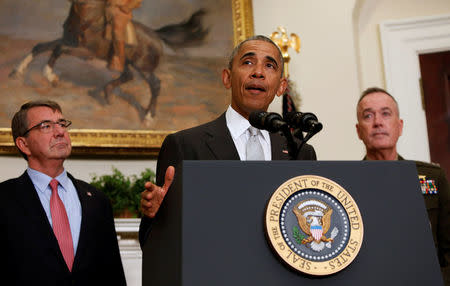 U.S. President Barack Obama, surrounded by U.S. Secretary of Defense Ash Carter (L) and the Chairman of the Joint Chiefs of Staff USMC General Joseph Dunford, Jr., (R) delivers a statement from the Roosevelt Room on Afghanistan at the White House in Washington U.S. July 6, 2016. JREUTERS/Gary Cameron