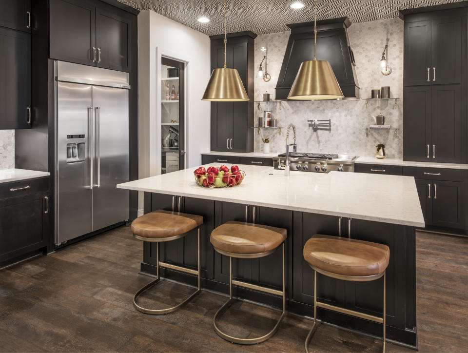 This photo provided by Ashton Woods shows a residential kitchen with a wallpaper ceiling in the Ashton Woods GlenPark community in Raleigh, N.C. (William Taylor/Taylorphoto/Ashton Woods via AP)