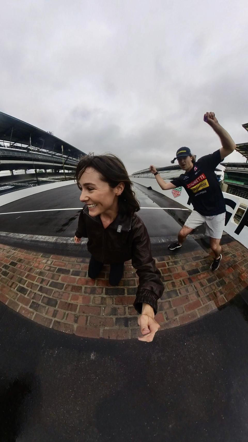 Kate Mackz interviewing racing driver Colton Herta during a lap around the Indianapolis Motor Speedway.