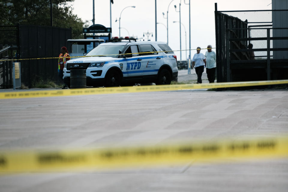 Police work along a stretch of beach at Coney Island in Brooklyn where a mother was suspected of drowning her children in the ocean on Sept. 12. 