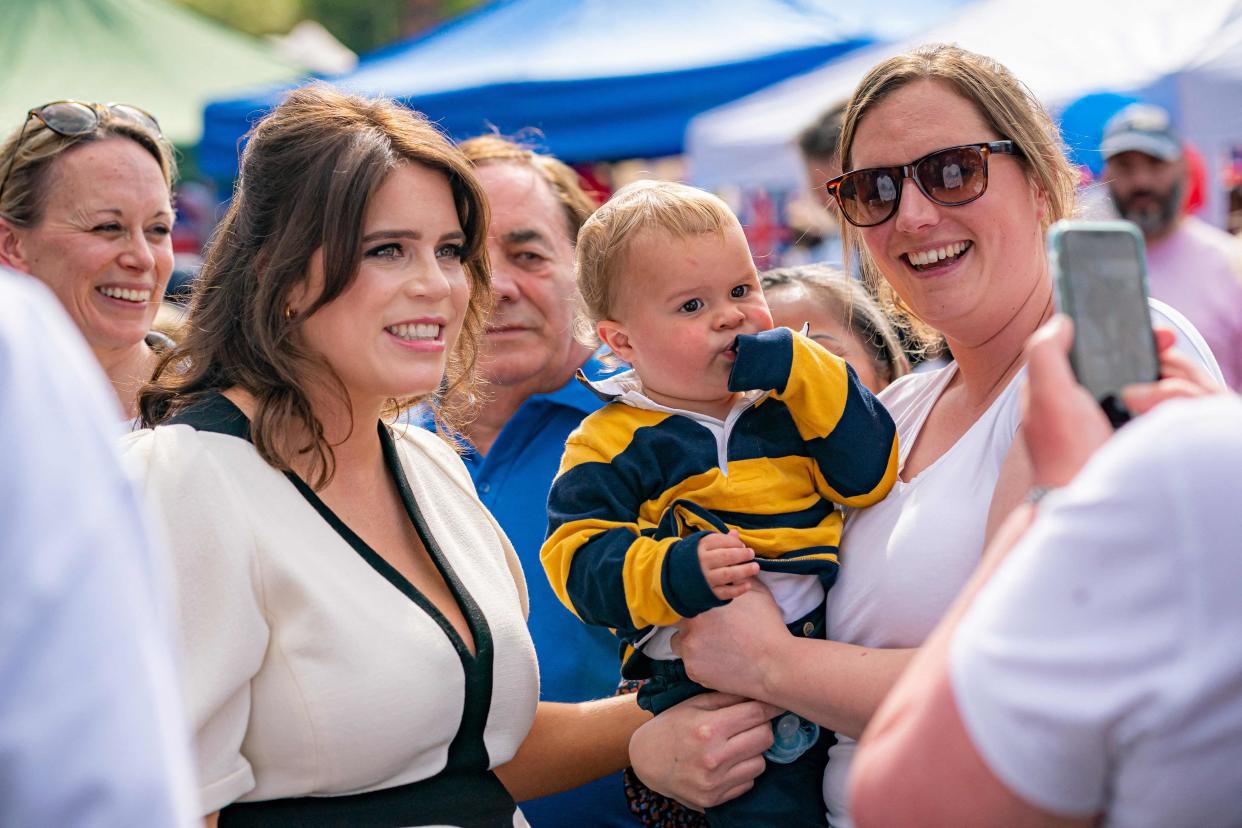 Eugenie poses with a young fan in Chalfont St Giles (POOL/AFP/Getty)