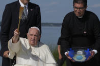 Pope Francis blesses as he arrives at the Lac Ste. Anne pilgrimage site in Alberta, Canada, Tuesday, July 26, 2022. Pope Francis is on a second day of a "penitential" six-day visit to Canada to beg forgiveness from survivors of the country's residential schools, where Catholic missionaries contributed to the "cultural genocide" of generations of Indigenous children by trying to stamp out their languages, cultures and traditions. (AP Photo/Gregorio Borgia)