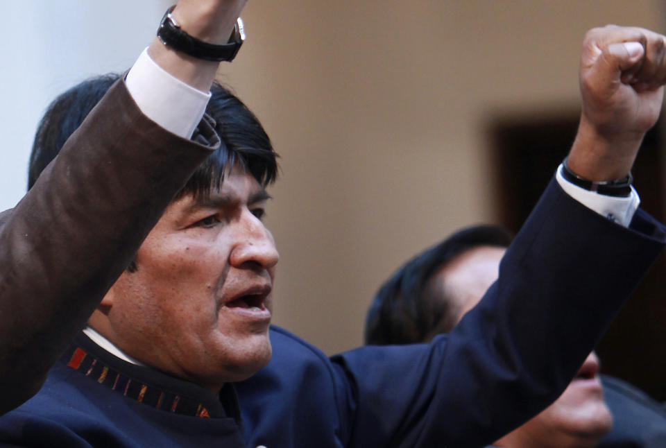 Bolivia's President Evo Morales sings his national anthem during an event at the government palace in La Paz, Bolivia, Tuesday, May 1, 2012. Morales says his government is completing the nationalization of the country's electricity industry by taking over its electrical grid from a Spanish-owned company. (AP Photo/Juan Karita)