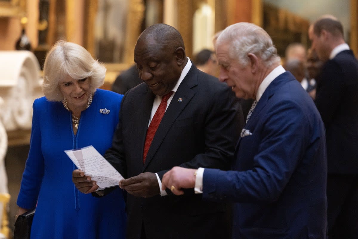 The Queen Consort, President Cyril Ramaphosa of South Africa and the King view a display of South African items from the Royal Collection (Dan Kitwood/PA) (PA Wire)