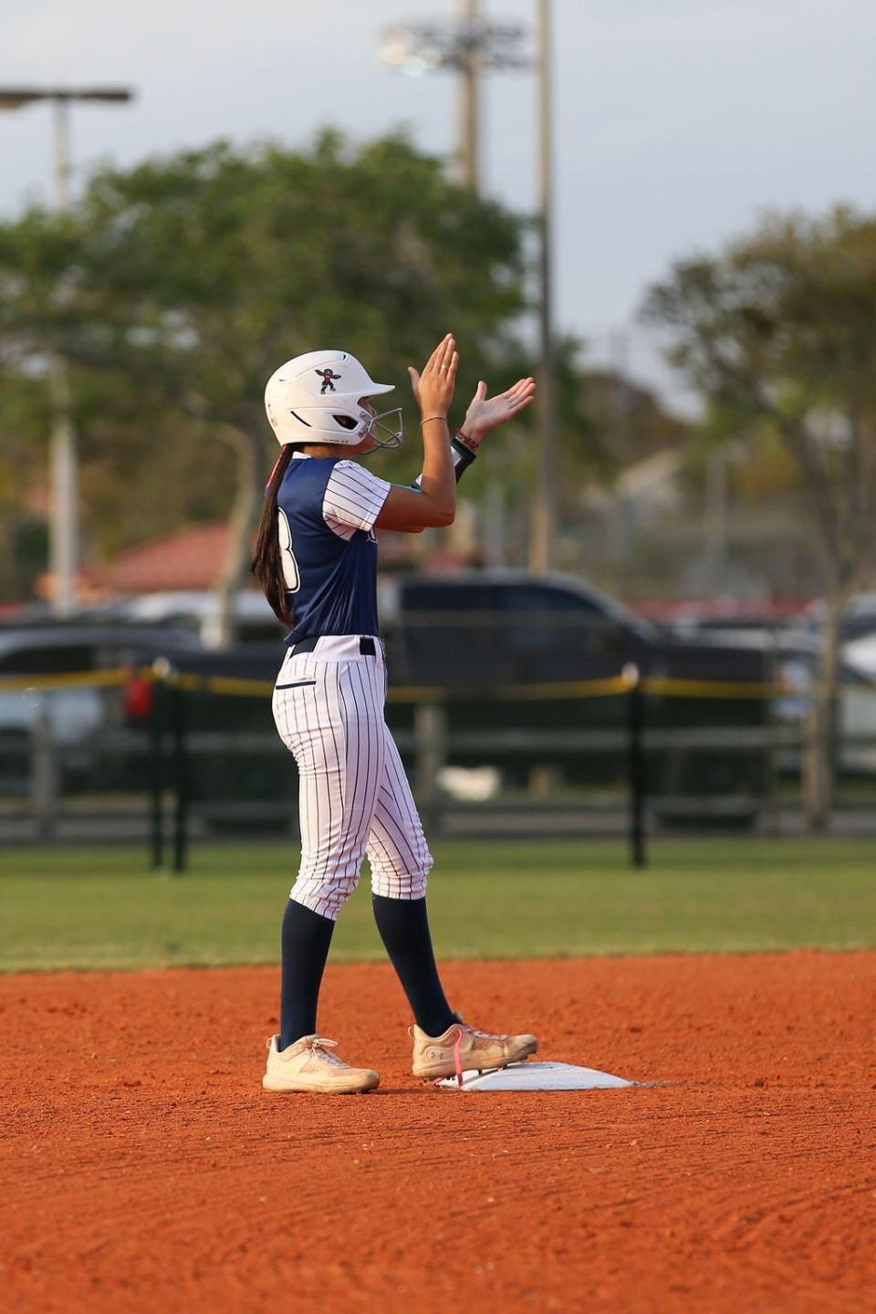 Spanish River's Sophia Camacho celebrates teammate moving her into scoring position against Park Vista on March 13, 2024 in Lake Worth Beach.