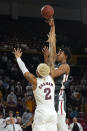 Washington State center Dishon Jackson shoots over Arizona State forward Jalen Graham (2) during the first half of an NCAA college basketball game, Wednesday, Dec. 1, 2021, in Tempe, Ariz. (AP Photo/Rick Scuteri)