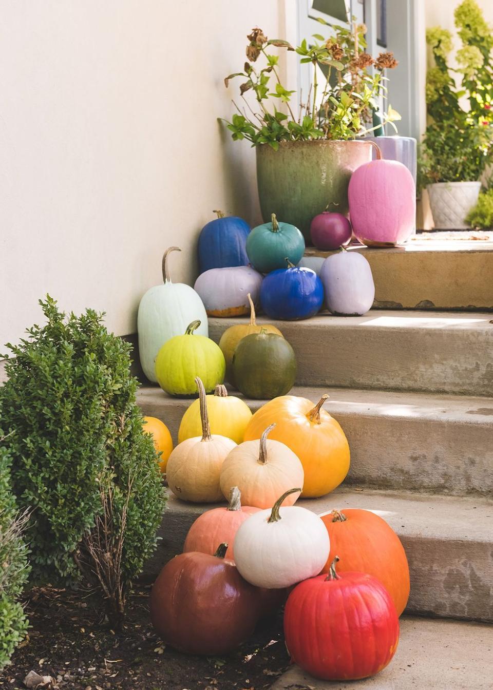 <p>If you went a little overboard at the pumpkin patch and have a lot of pumpkins to work with, try painting each one a different color to create a chic rainbow effect. </p><p><em><a href="https://thehousethatlarsbuilt.com/2018/10/diy-rainbow-pumpkins.html/" rel="nofollow noopener" target="_blank" data-ylk="slk:Get the tutorial at The House That Lars Built »;elm:context_link;itc:0;sec:content-canvas" class="link ">Get the tutorial at The House That Lars Built »</a></em></p>
