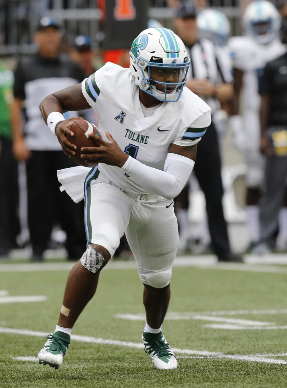 Tulane quarterback Jonathan Banks looks for an opening to run through against Ohio State during the first half of an NCAA college football game Saturday, Sept. 22, 2018, in Columbus, Ohio. (AP Photo/Jay LaPrete)