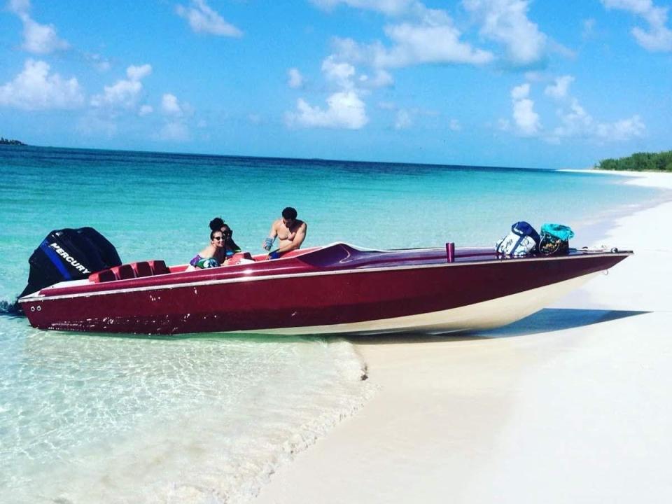 Nicole Bedford with her friends in red boat on Rose Island