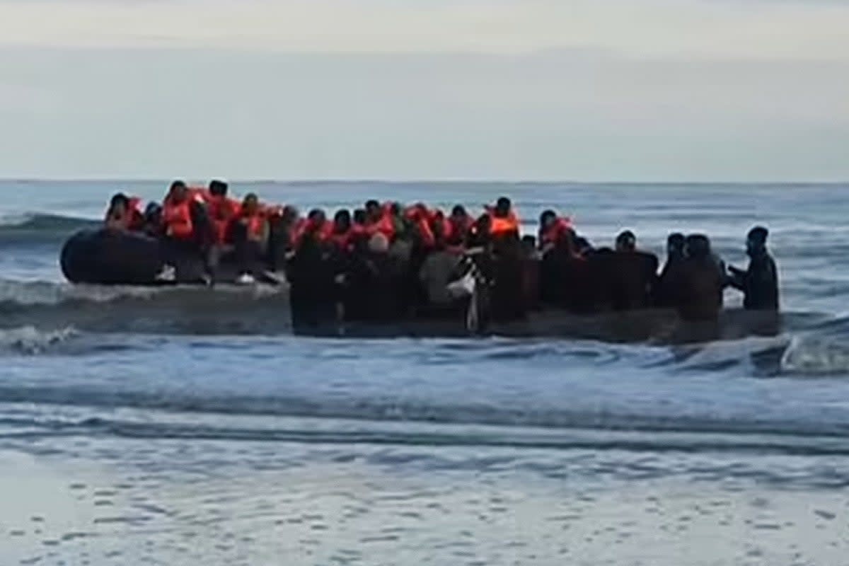Migrants board a small boat leaving Dunkirk on Tuesday morning - the same day five migrants died attempting the English Channel crossing  (BBC)