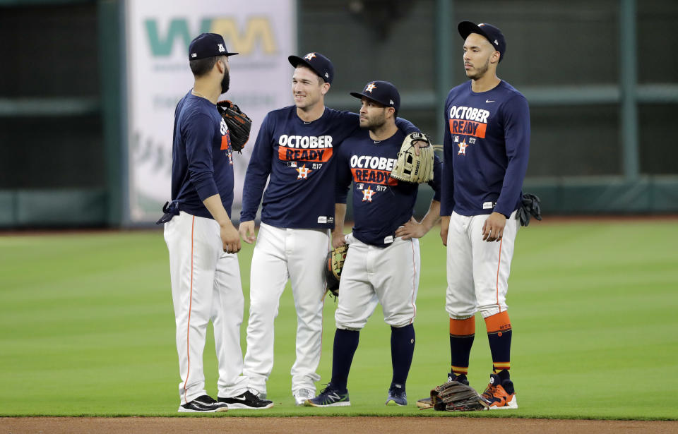 Alex Bregman, center with teammates Jose Altuve, Carlos Correa and Marwin Gonzalez. (AP) 