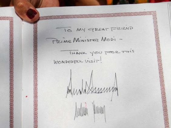 The Trump's both signed the visitors' book at the Ashram set up by Mahatma Gandhi (Indian Ministry of External Affairs/AFP)
