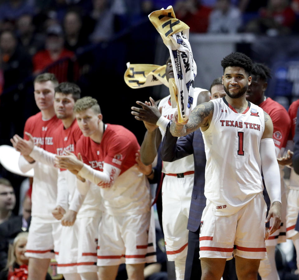 The Texas Tech bench celebrate after a basket during the second half of a first round men's college basketball game against Northern Kentucky in the NCAA Tournament Friday, March 22, 2019, in Tulsa, Okla. Texas Tech won 72-57. (AP Photo/Charlie Riedel)