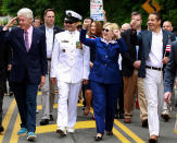 <p>Hillary Clinton takes part in the Memorial Day parade with her husband, former President Bill Clinton, left, and New York Gov. Andrew Cuomo, right, in Chappaqua, N.Y., on Monday, May 30, 2016 . (Photo: Adrees Latif/Reuters) </p>