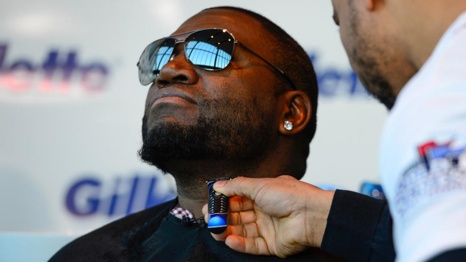 Mandatory Credit: Photo by John Cetrino/Invision/AP/Shutterstock (9194526g)Red Sox designated hitter David Ortiz sheds his playoff beard to celebrate his team's World Series victory at Gillette World Shaving HeadquartersRed Sox Shave-Down, Boston, USA - 4 Nov 2013.