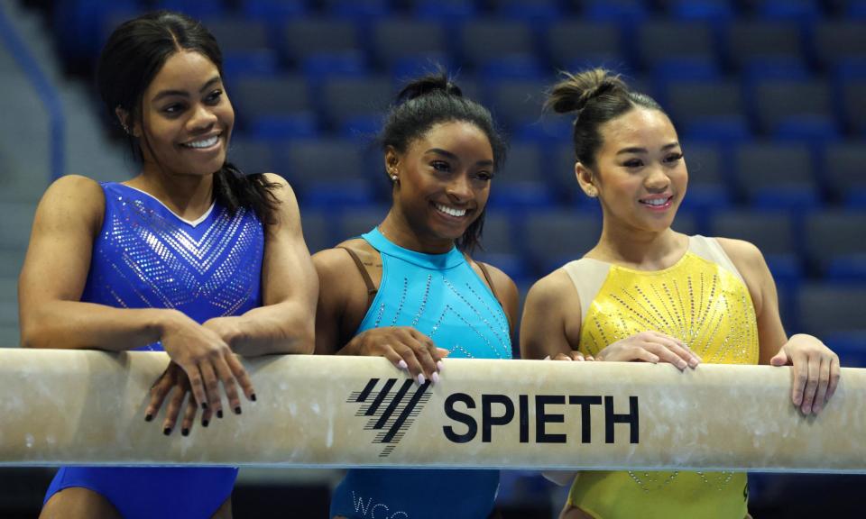 <span>Gabby Douglas, Simone Biles and Sunisa Lee, from left, pose for photographs after a training session on Friday at the XL Center ahead of the US Classic in Hartford, Connecticut.</span><span>Photograph: Charly Triballeau/AFP/Getty Images</span>