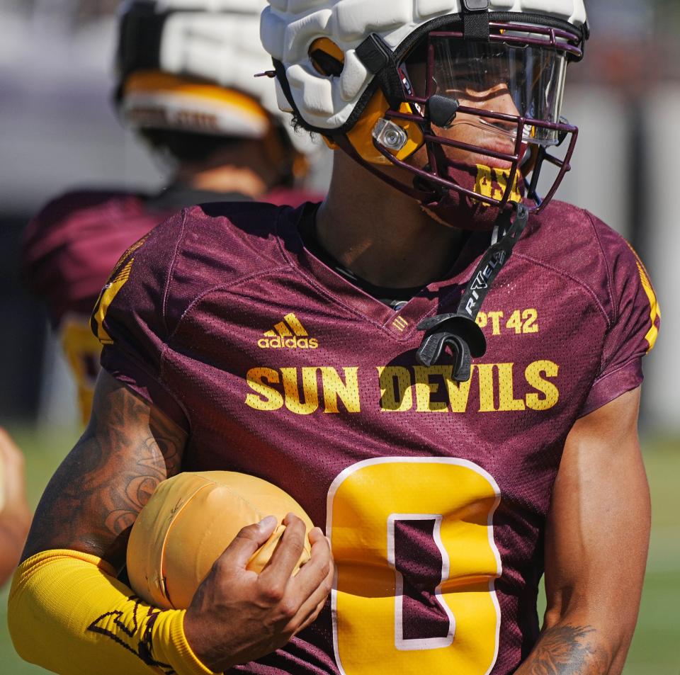 ASU wide receiver Jordyn Tyson (0) warms up with his teammates during a spring practice at the Kajikawa practice fields in Tempe on April 16, 2024.