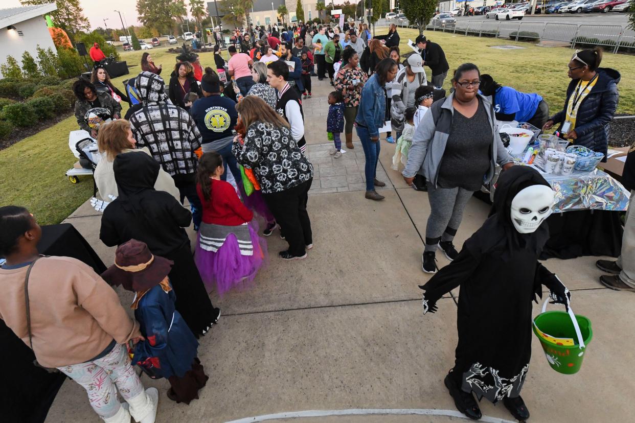 Oct 26, 2022; Tuscaloosa, Alabama, USA;  Kids and parents make their way through the numbers stations as they enjoy the Halloween fun at the Tech or Treat event at the Gateway Innovation and Discovery Center Wednesday, Oct. 26, 2022.