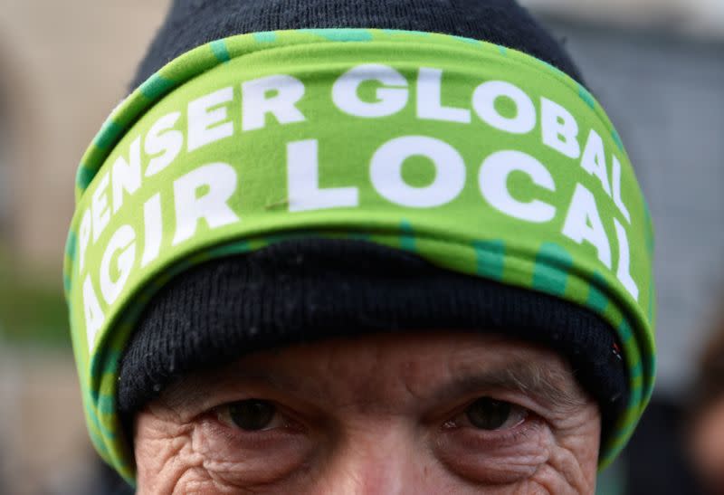 A man attends a climate change protest in Brussels