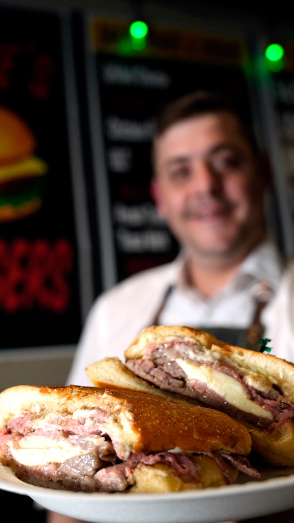 Stephen Chrisomalis, of Steve's Burgers, poses with his new roast beef sandwich, which he is calling the North Jersey Eats Hungry Reporter.