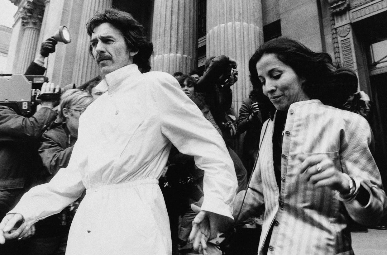 Former Beatle George Harrison and his Mexican-born wife Olivia left Marylebone Register office in London after attending the wedding of former Beatle drummer Ringo Starr who wed actress Barbara Bach, April 27, 1981.