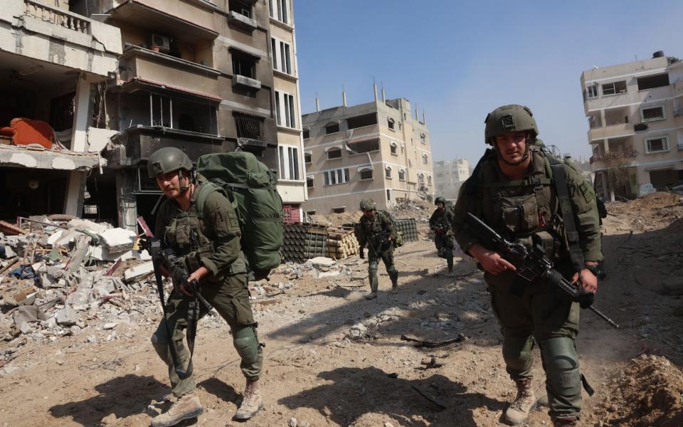 Israeli troops conduct a patrol in Gaza's southern city of Khan Younis