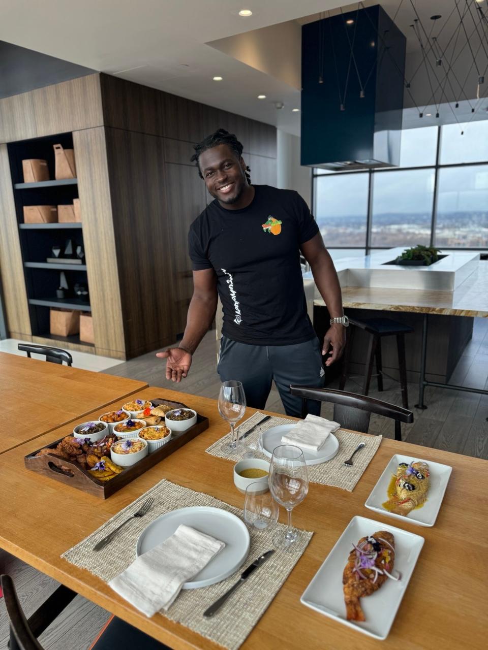 Kervin Edouard, owner of Swerv Catering, makes traditional Haitian dishes and delivers them to hundreds of Haitian migrants living in hotels in the Boston area.