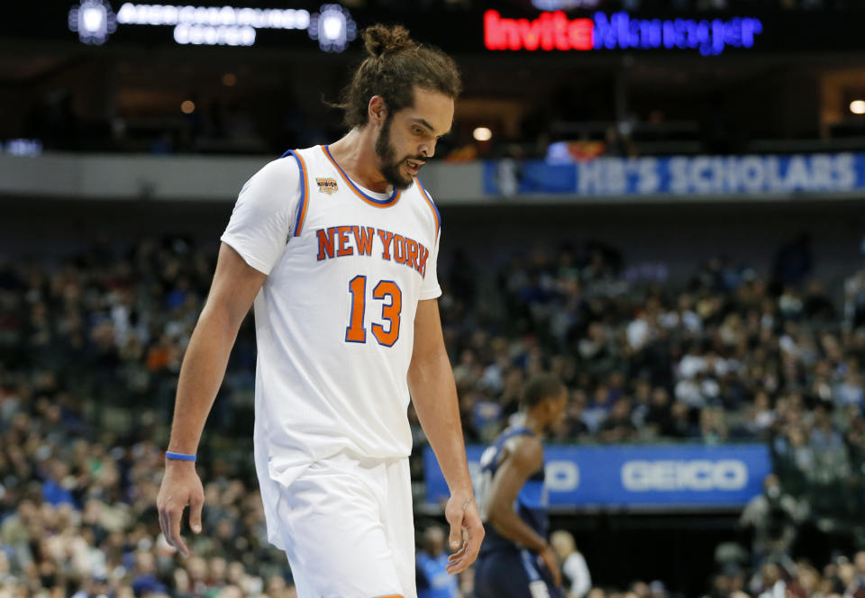 FILE - In this Jan. 25, 2017, file photo, New York Knicks' Joakim Noah (13) walks to the bench during a time out in the second half of an NBA basketball game against the Dallas Mavericks in Dallas. Noah’s disappointing Knicks career is over after just two seasons. Unable to find a trade, the Knicks waived the center Saturday, Oct. 13, 2018, with two years and $37.8 million remaining on his contract. (AP Photo/Tony Gutierrez, File)