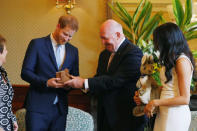 Britain's Prince Harry and wife Meghan, Duchess of Sussex look at gifts with Australia's Governor General Peter Cosgrove and wife Lynne Cosgrove at Admiralty House during their visit in Sydney, Australia October 16, 2018. REUTERS/Phil Noble/Pool